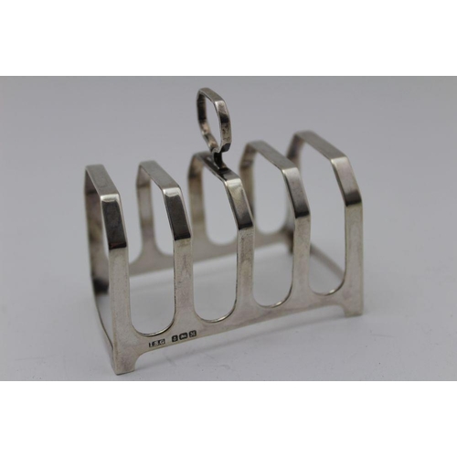 31 - Israel Sigmund Greenburg, a pair of Art Deco design silver toast racks, Birmingham 1936/38, 7.5cm x ... 