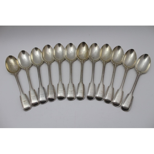 51 - John Aldwinckle and Thomas Slater, a set of twelve fiddle & thread pattern silver dessert spoons, cr... 