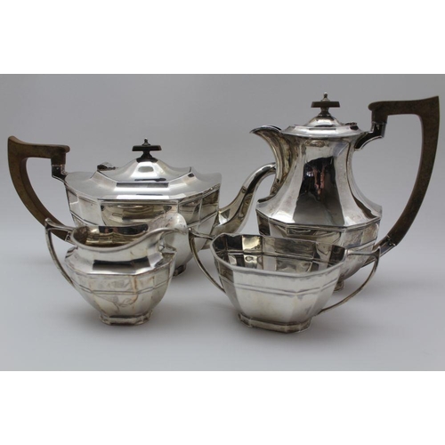 56 - Cooper Brothers & Sons Ltd A four piece silver tea set of canted Georgian design, comprising teapot,... 