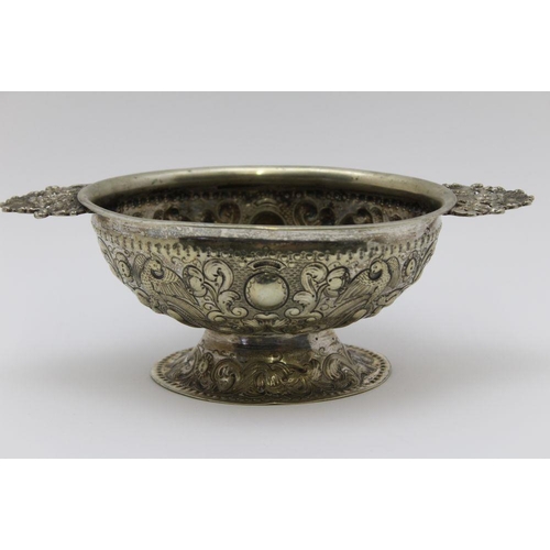 7 - An early 18th century Dutch silver plated oval bowl, applied cast handles, repousse bird and acanthu... 