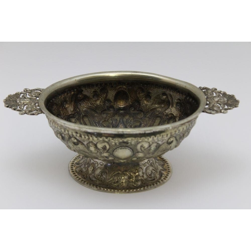 7 - An early 18th century Dutch silver plated oval bowl, applied cast handles, repousse bird and acanthu... 