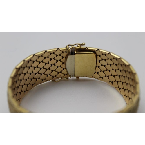 72 - An 18ct gold articulated bangle, mixed colour gold band with twin lozenge decoration, stamped 750, w... 