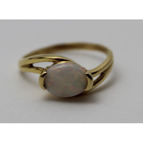 73 - An 18k gold ring set an oval cabochon opal, gross weight: 3.6g, ring size: 'P' (in heart shaped ring... 