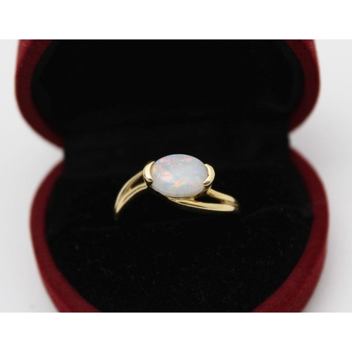 73 - An 18k gold ring set an oval cabochon opal, gross weight: 3.6g, ring size: 'P' (in heart shaped ring... 