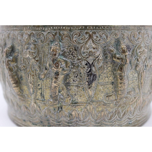 9 - An early 20th century Far Eastern embossed metal bowl & cover, the cover has handle finial of a danc... 