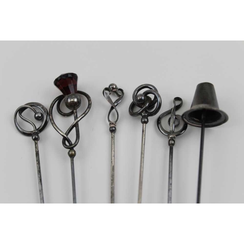 145 - A collection of six Charles Horner hatpins, one with the terminal in the form of a Welsh hat