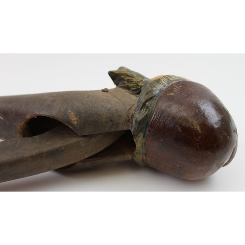 159 - A mid 20th century carved wood Black Forest nutcracker, in the form of a man's head with sideburns a... 