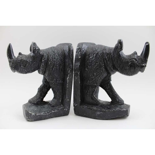 171 - A pair of 20th century carved soft stone rhino form bookends, 15.5cm high, together with a cow's hor... 