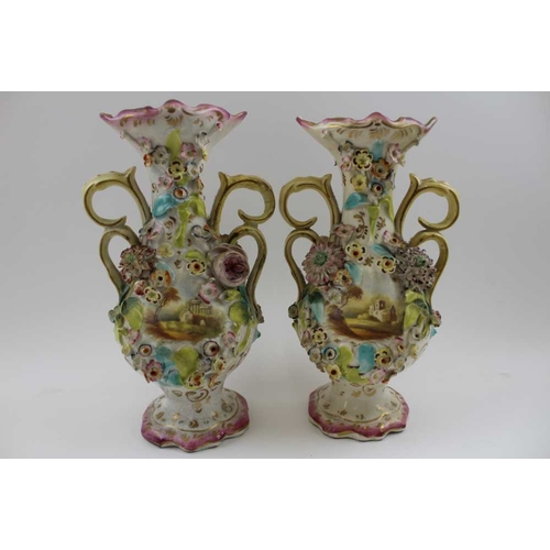 83 - A garniture set of three Victorian Colebrookdale type ceramic vases, each of baluster form, with scr... 