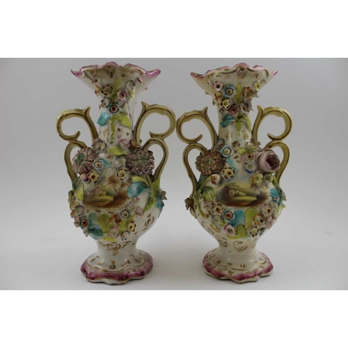 83 - A garniture set of three Victorian Colebrookdale type ceramic vases, each of baluster form, with scr... 