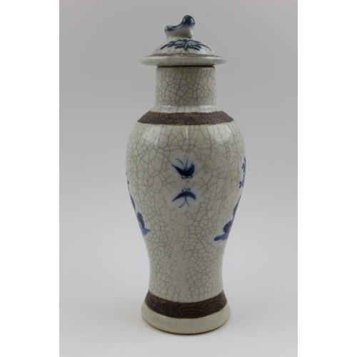 88 - A 20th century Chinese ceramic vase, with crackle glaze, of baluster form, cobalt painted with Bejin... 