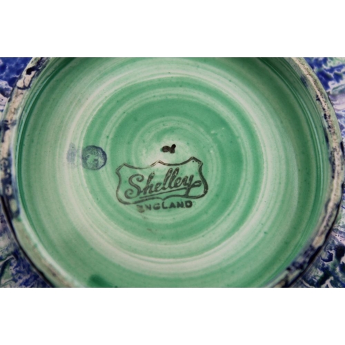 94 - An Art Deco Shelley ceramic bowl of octagonal form, glazed in a blue, green, and purple drip pattern... 