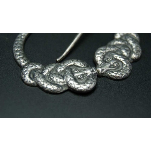 115 - An Iona Scottish silver brooch pin in the form of intertwined serpents, cast to the back with the in... 