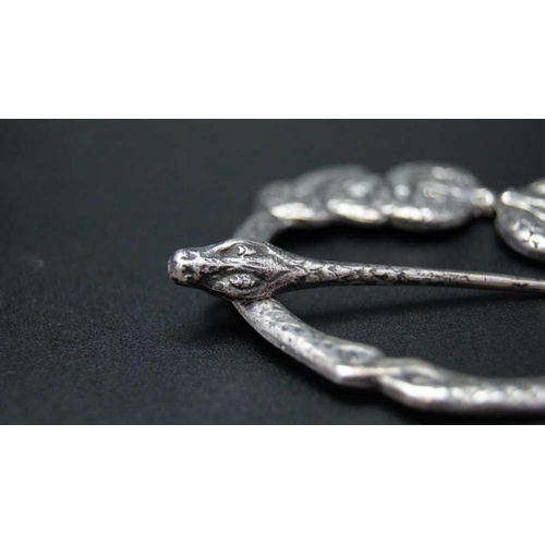 115 - An Iona Scottish silver brooch pin in the form of intertwined serpents, cast to the back with the in... 