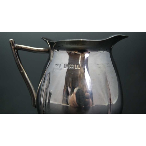 121 - Three small silver cream jugs, varying designs, makers and years, all Birmingham, combined weight:92... 