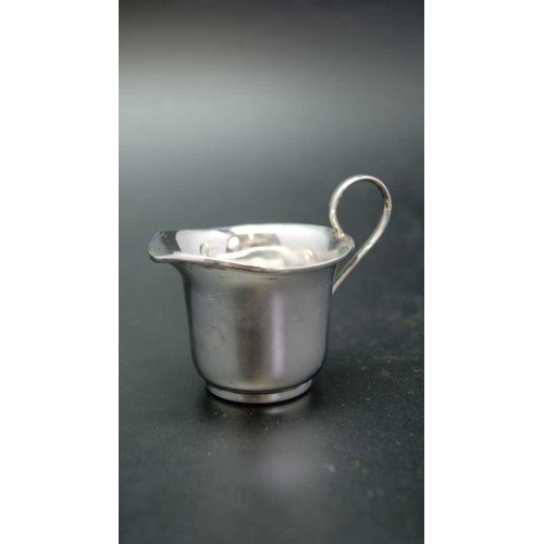 121 - Three small silver cream jugs, varying designs, makers and years, all Birmingham, combined weight:92... 