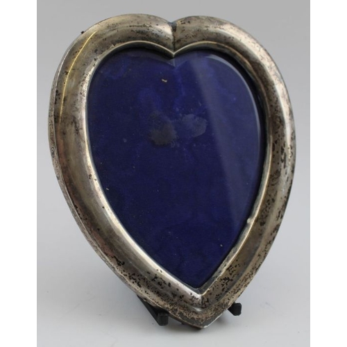 136 - Synyer & Beddoes, A pair of late Victorian heart shape silver mounted photograph frames, glazed, ori... 