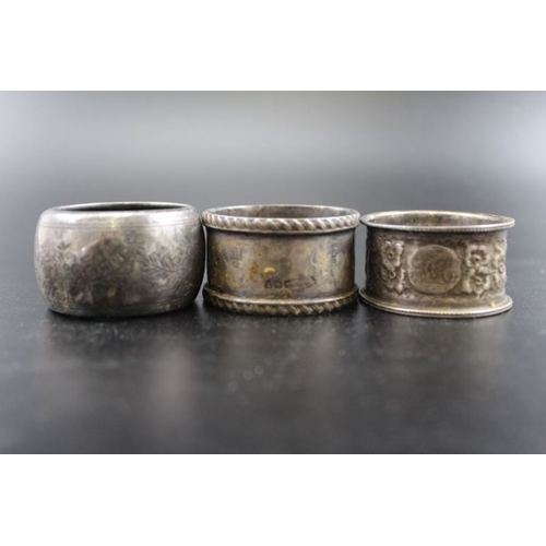 148 - A collection of five various silver napkin rings, combined weight: 103g, together with two Eastern d... 