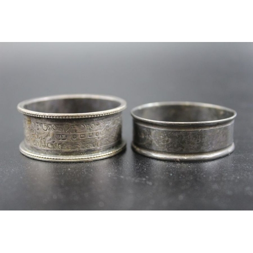 148 - A collection of five various silver napkin rings, combined weight: 103g, together with two Eastern d... 