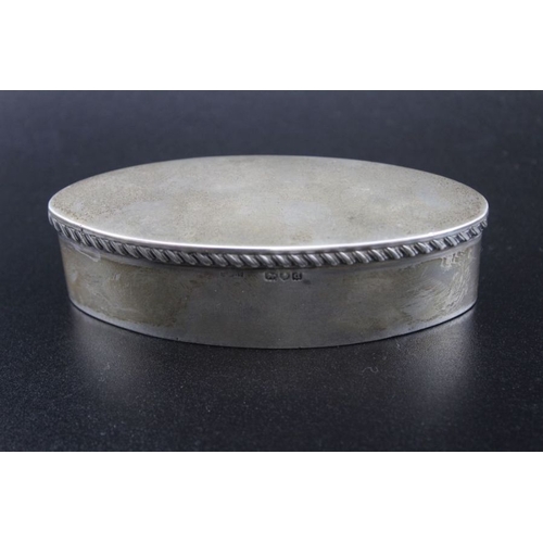 152 - Stokes & Ireland limited, a late Victorian silver box of elliptical form, the hinged cover with gadr... 