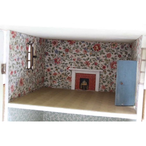 171 - A large dolls house, with a quantity of Mobil furniture