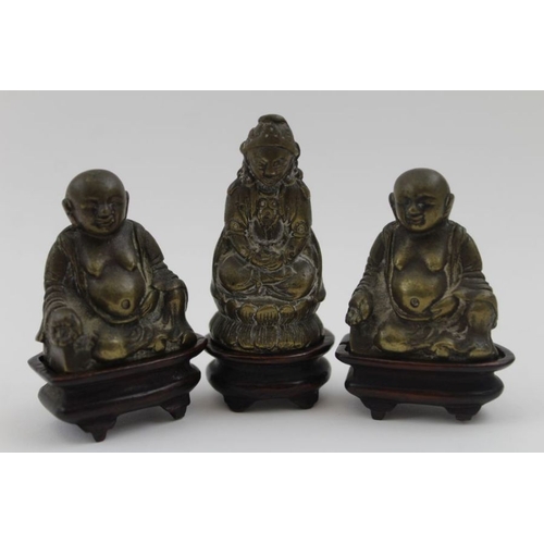 178 - Three 19th century cast brass Eastern Deities / Buddhas, each raised upon wooden plinth bases, the t... 