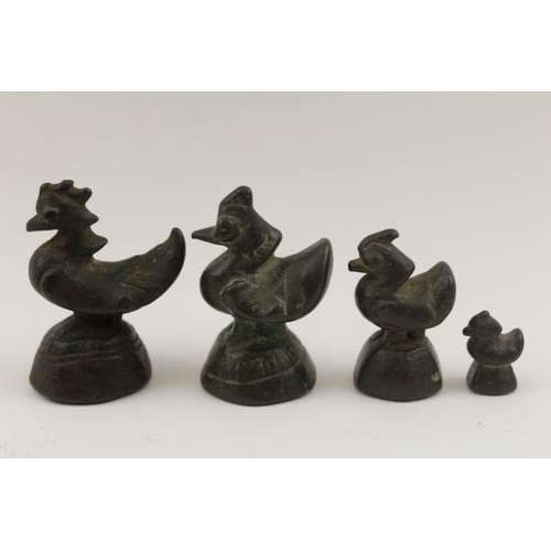 179 - A collection of 19th century bronze opium weights, includes four cockerels and five elephants, the l... 