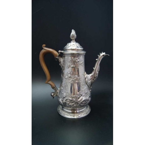 2 - Jacob Marsh, an early George III silver coffee pot, embossed decoration, baluster form, bears crest,... 