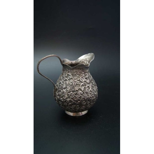 23 - A 19th century Indian Kutch silver cream jug, c.1880, 127g