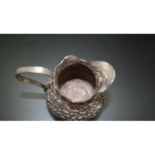 23 - A 19th century Indian Kutch silver cream jug, c.1880, 127g