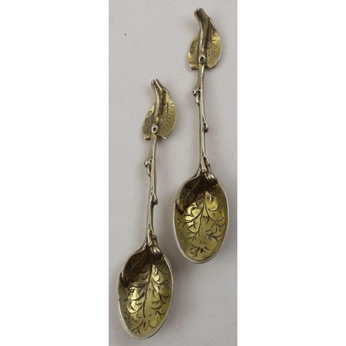 62 - Sebastian Crepel II, A pair of early Victorian cast silver gilt leaf teaspoons, London 1842, 42g