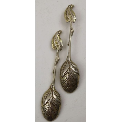 62 - Sebastian Crepel II, A pair of early Victorian cast silver gilt leaf teaspoons, London 1842, 42g