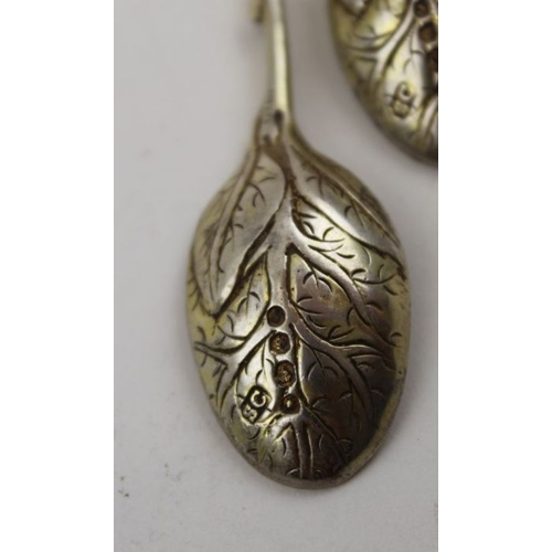 62 - Sebastian Crepel II, A pair of early Victorian cast silver gilt leaf teaspoons, London 1842, 42g