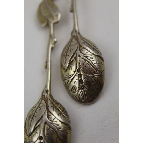 62 - Sebastian Crepel II, A pair of early Victorian cast silver gilt leaf teaspoons, London 1842, 42g