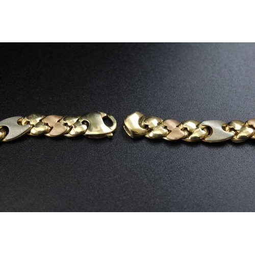 101 - A continental 18K gold double wrap around bracelet fancy mixed gold links with extra link 51g