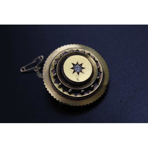 104 - A 19th century 18ct gold brooch, circular form inset solitaire central diamond, glazed panel with pi... 