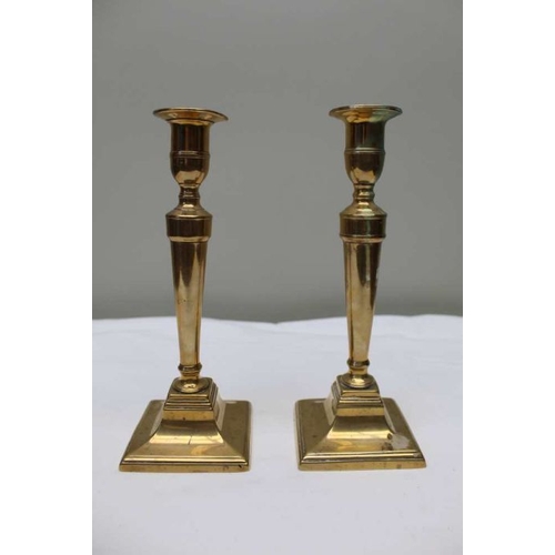 117 - A pair of 19th century Georgian design brass candlesticks, 23cm high, and a pair of Georgian design ... 