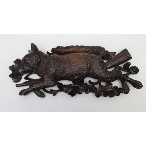 123 - A pair of 19th century Black Forest carved wall mounts, comprising a fox and a rabbit upon rifle and... 