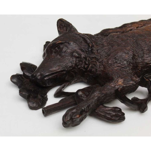 123 - A pair of 19th century Black Forest carved wall mounts, comprising a fox and a rabbit upon rifle and... 