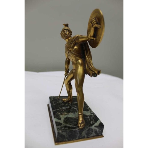 124 - A gilt bronze statue after the Antique, of a gladiator with shield and sword, on polished marble bas... 