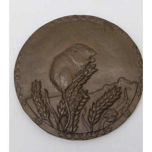 126 - A cast decorative plaque with harvest mouse, 14cm in diameter, together with a cast & gilded metal l... 