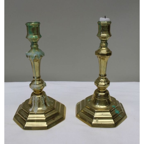 127 - A pair of early 19th century Georgian design brass candlesticks, 24cm high