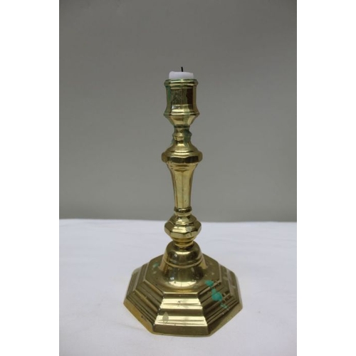 127 - A pair of early 19th century Georgian design brass candlesticks, 24cm high