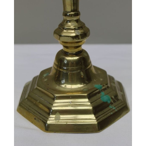 127 - A pair of early 19th century Georgian design brass candlesticks, 24cm high