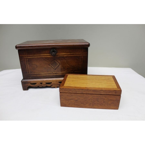 128 - A 19th century mahogany table casket, line inlay, on pierced platform base, the lid opens to reveal ... 