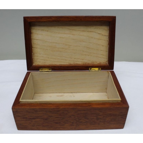 128 - A 19th century mahogany table casket, line inlay, on pierced platform base, the lid opens to reveal ... 