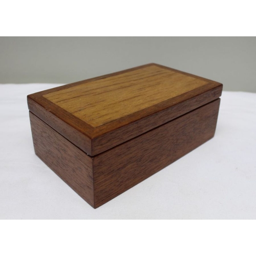 128 - A 19th century mahogany table casket, line inlay, on pierced platform base, the lid opens to reveal ... 