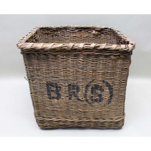 129 - A  log basket bearing the initials BRS (British Rail Southern) with rope handles 67cm tall