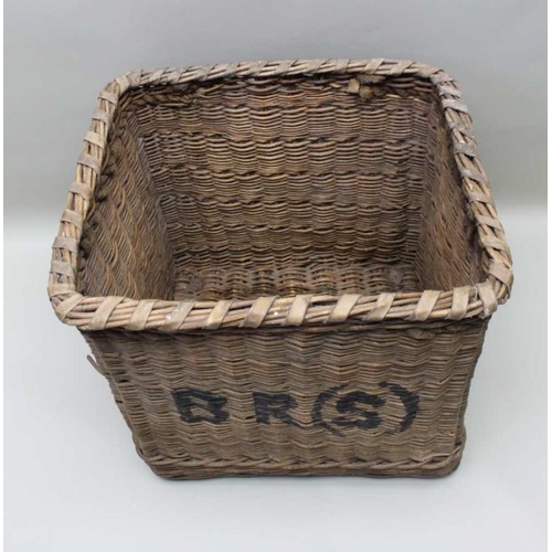 129 - A  log basket bearing the initials BRS (British Rail Southern) with rope handles 67cm tall