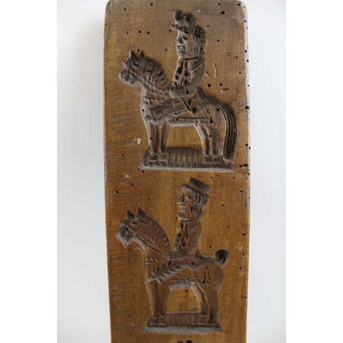 132 - A 19th century Dutch gingerbread board, bears four equestrian designs, 43cm x 8cm